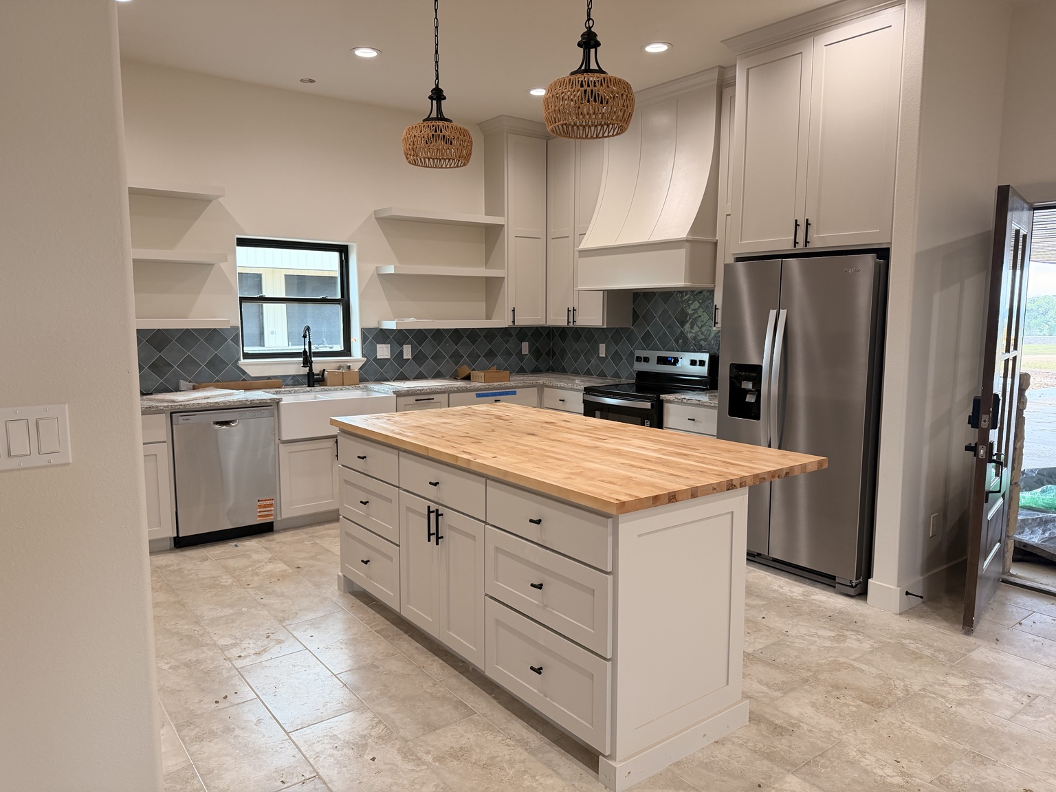 Butcher block island countertop installed in a residential kitchen